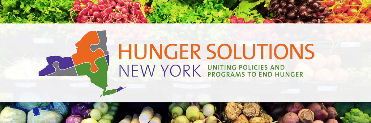 Produce aisle with Hunger Solutions New York logo